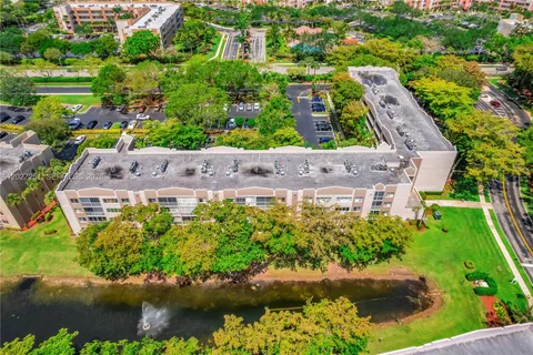 an aerial view of residential house with outdoor space and lake view