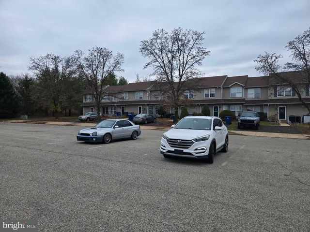 a car parked in front of a houses