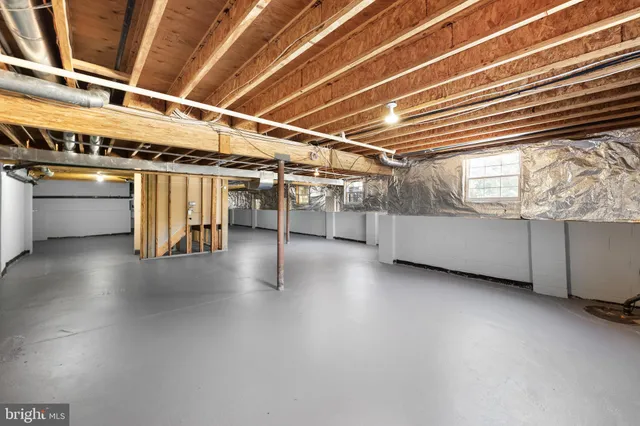 a view of an empty room with windows