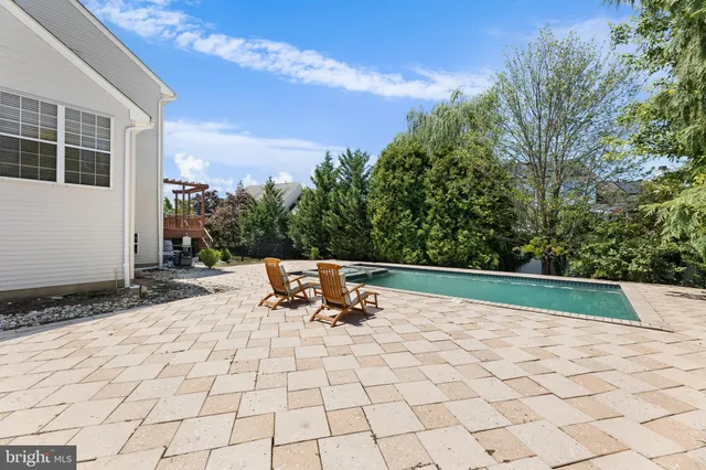 a view of a backyard with sitting area
