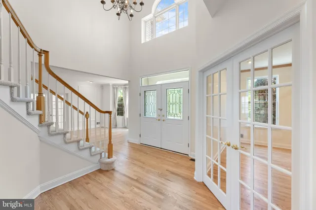 a view of an entryway with wooden floor and windows