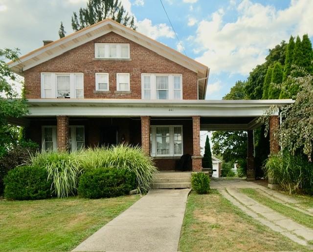 a front view of a house with garden