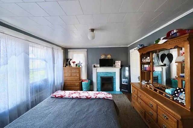 a bedroom with furniture and flat screen tv