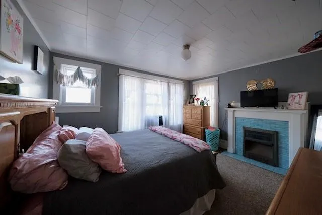 a bed room with a bed and a fireplace