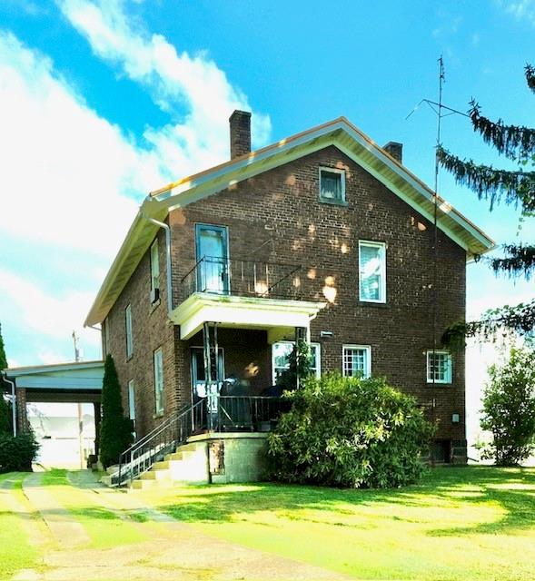 441 Main Street Rimersburg, PA 16248 - Photo 3 of 28 a front view of a house with garden