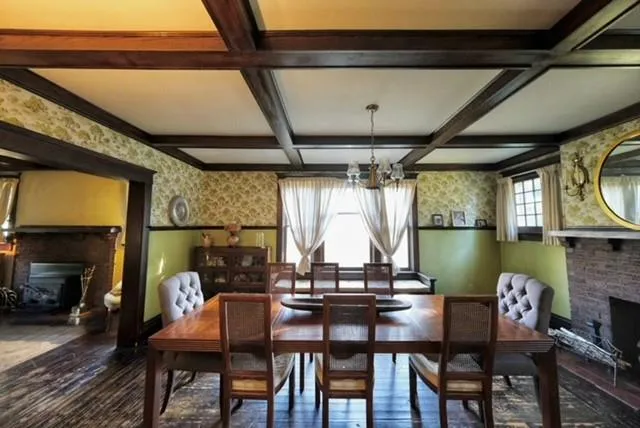 a view of a dining room with furniture and a window