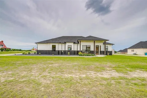 a front view of a house with a swimming pool