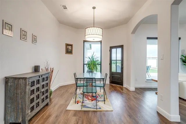 a dining room with furniture window wooden floor