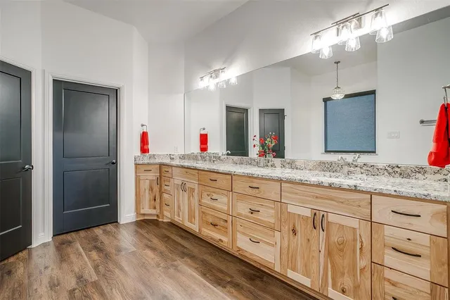 a bathroom with a bathtub and shower
