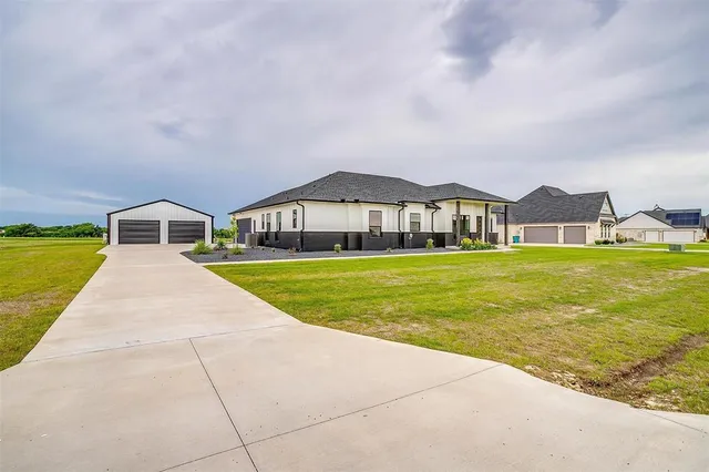 a bedroom with a large bed and window