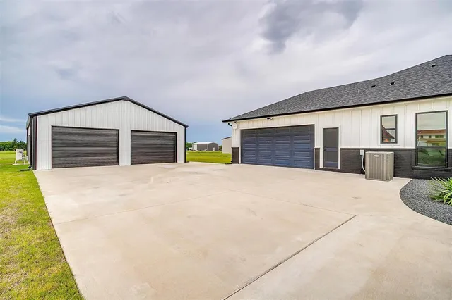 a view of swimming pool with outdoor seating and yard