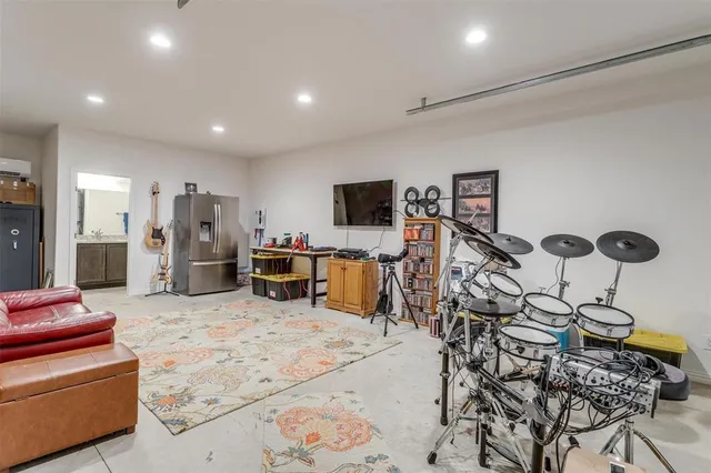 a living room with furniture a bike and a table