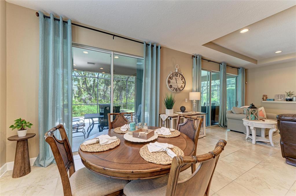 5307 65th Terrace East Ellenton, FL 34222 - Photo 22 of 47 a view of a dining room with furniture window and outside view