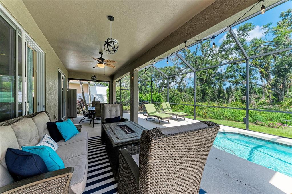 5307 65th Terrace East Ellenton, FL 34222 - Photo 26 of 47 a view of a patio with couches table and chairs