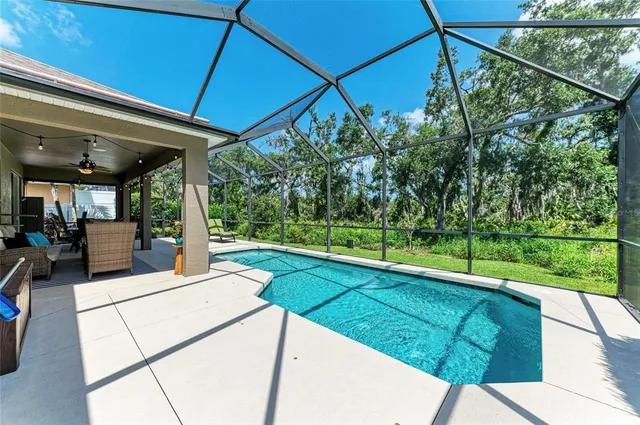 a view of a backyard with sitting area