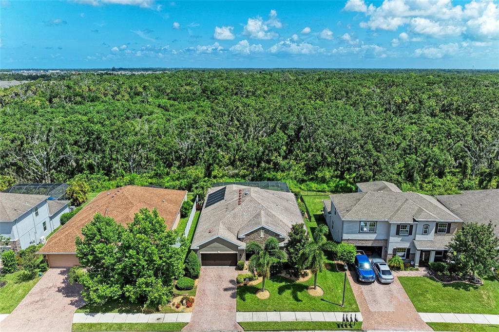 5307 65th Terrace East Ellenton, FL 34222 - Photo 3 of 47 a view of house with garden space and trees