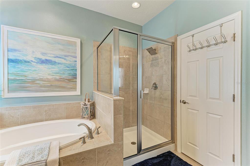 5307 65th Terrace East Ellenton, FL 34222 - Photo 34 of 47 a bathroom with a bathtub and a shower