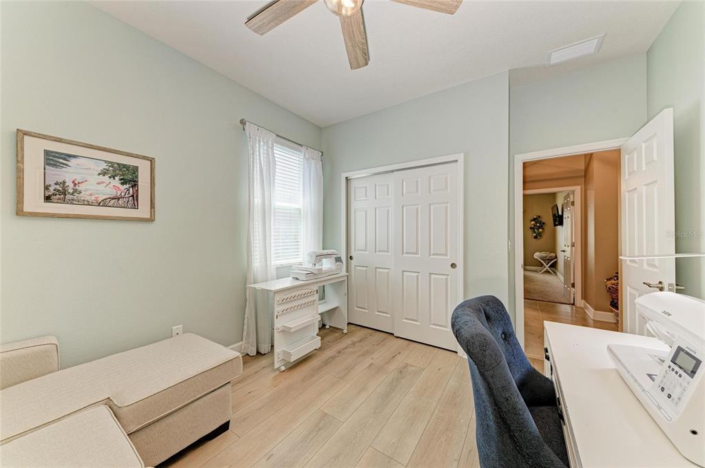 5307 65th Terrace East Ellenton, FL 34222 - Photo 40 of 47 a bedroom with a bed and a couch