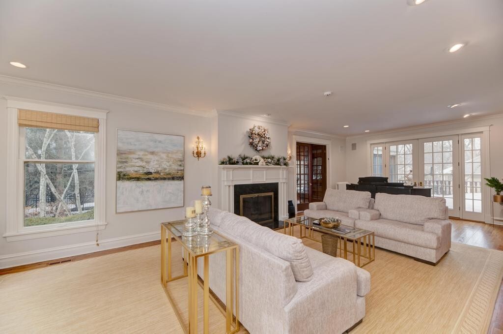 1499 Sheridan Road Highland Park, IL 60035 - Photo 11 of 87 a living room with furniture a fireplace and a large window