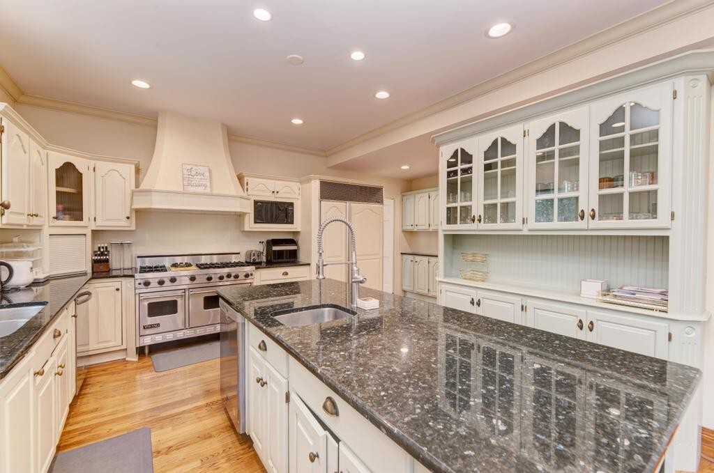 1499 Sheridan Road Highland Park, IL 60035 - Photo 28 of 87 a kitchen with stainless steel appliances granite countertop a stove sink and cabinets