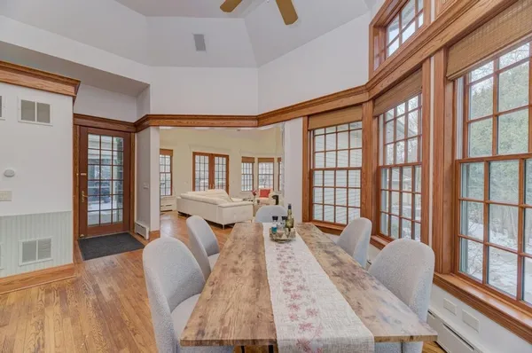 a spacious bedroom with a bed and a chandelier