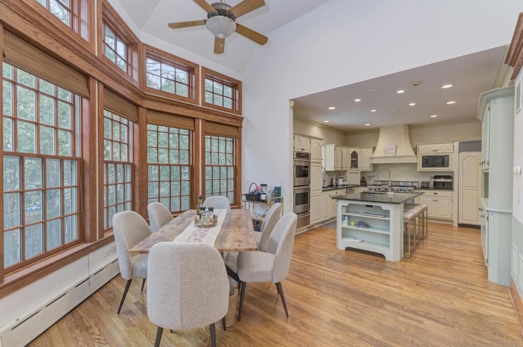 1499 Sheridan Road Highland Park, IL 60035 - Photo 33 of 87 a view of a dining room with furniture a chandelier and wooden floor
