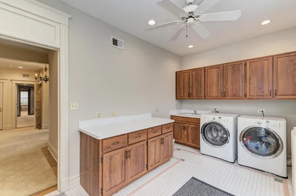 a bedroom with furniture and a wooden floor