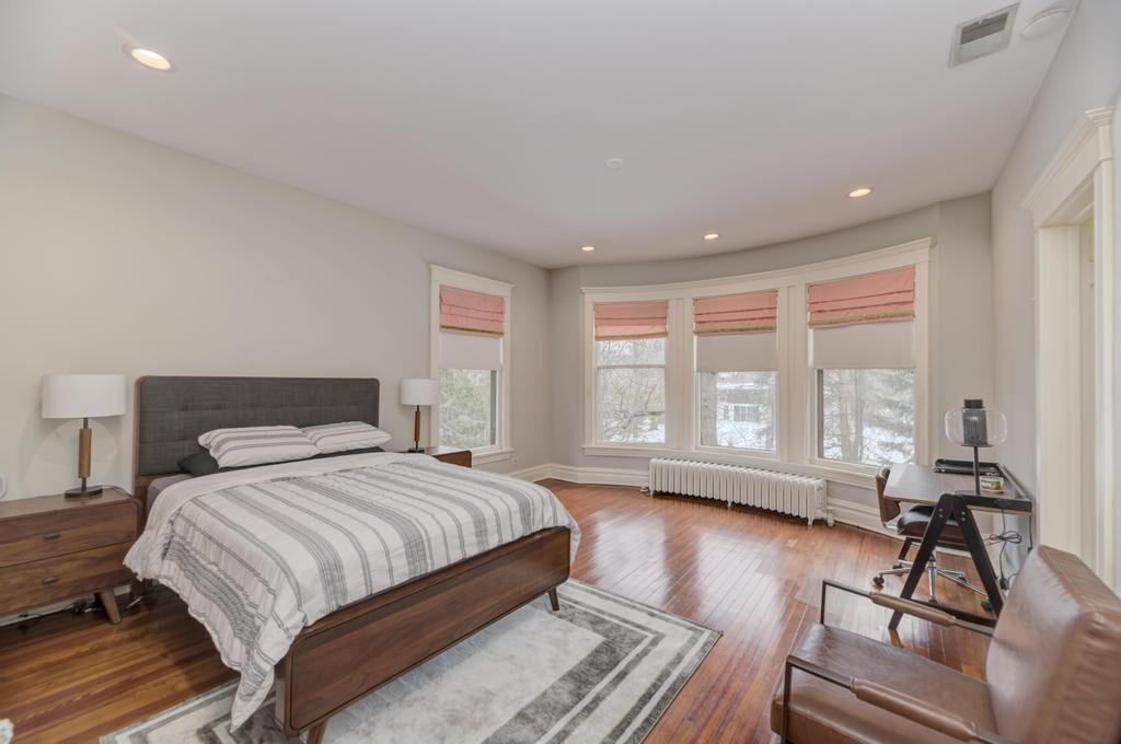 1499 Sheridan Road Highland Park, IL 60035 - Photo 41 of 87 a spacious bedroom with a bed and a large window