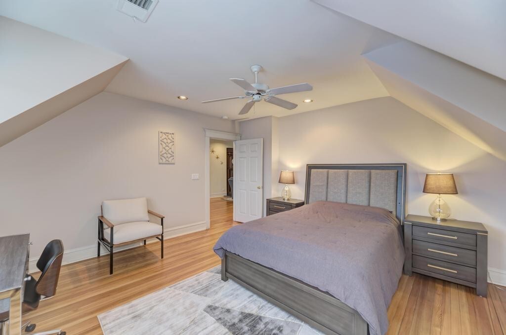 1499 Sheridan Road Highland Park, IL 60035 - Photo 60 of 84 a bedroom with a bed and a chair