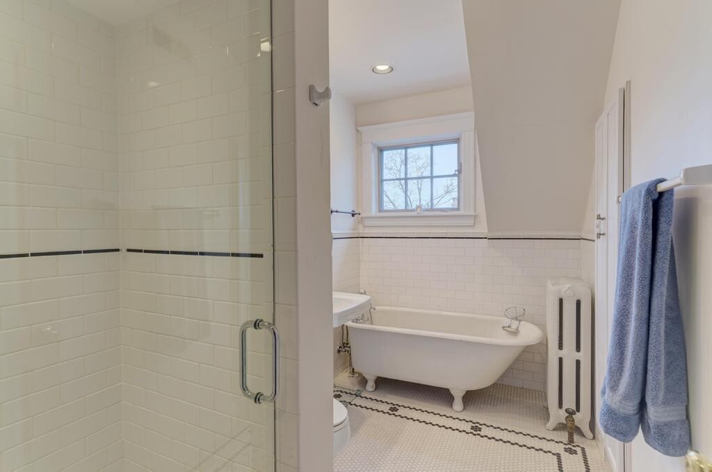 1499 Sheridan Road Highland Park, IL 60035 - Photo 63 of 84 a bathroom with a bathtub and a shower