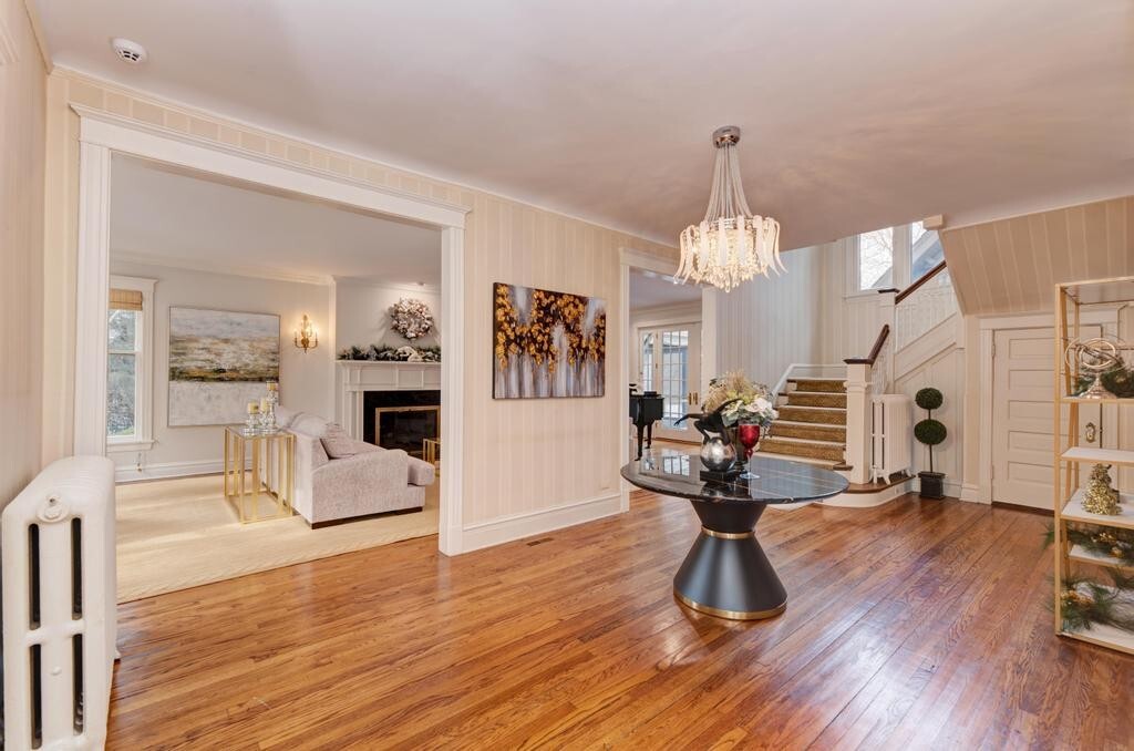 1499 Sheridan Road Highland Park, IL 60035 - Photo 7 of 87 a view of a living room and kitchen with furniture wooden floor