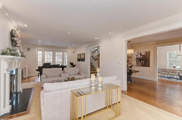 a living room with furniture and large windows
