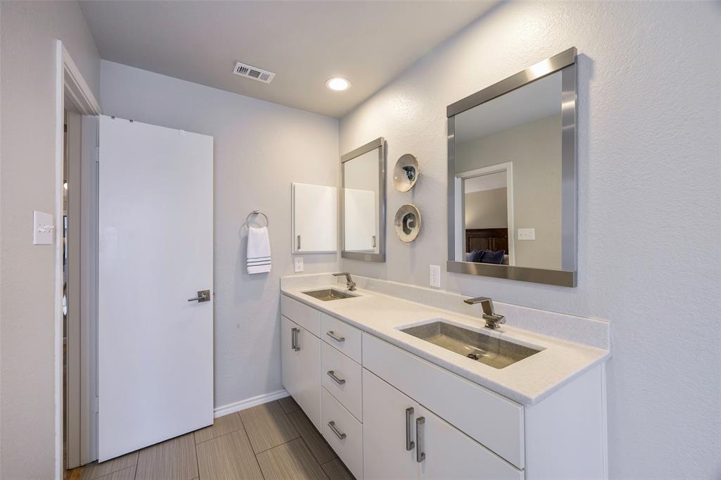 2903 Fort Point Lane Carrollton, TX 75007 - Photo 19 of 27 a bathroom with a sink double vanity and a mirror