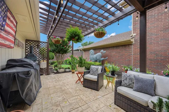 a view of a patio with couches and potted plants