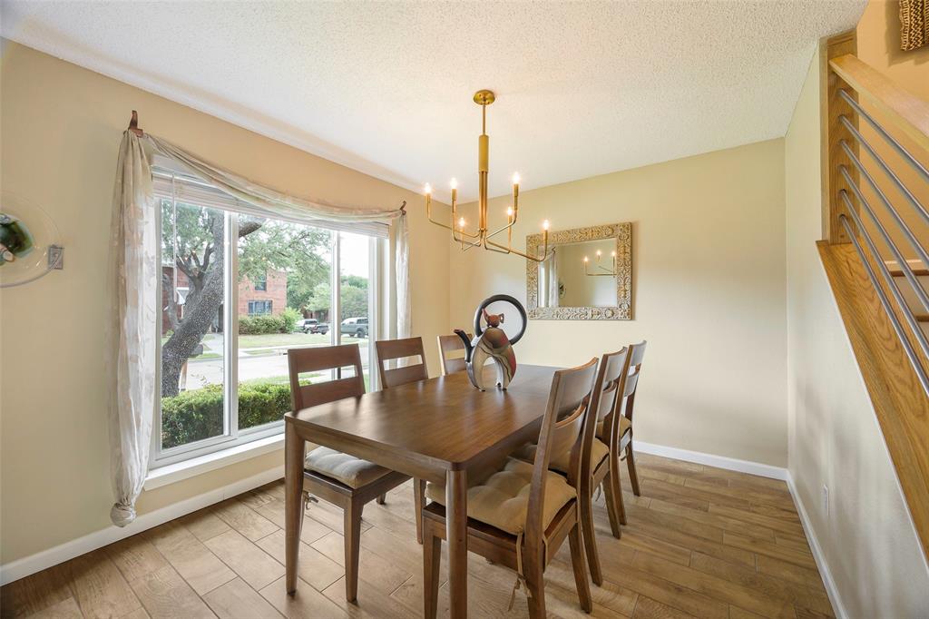 2903 Fort Point Lane Carrollton, TX 75007 - Photo 5 of 27 a view of a dining room with furniture window and wooden floor