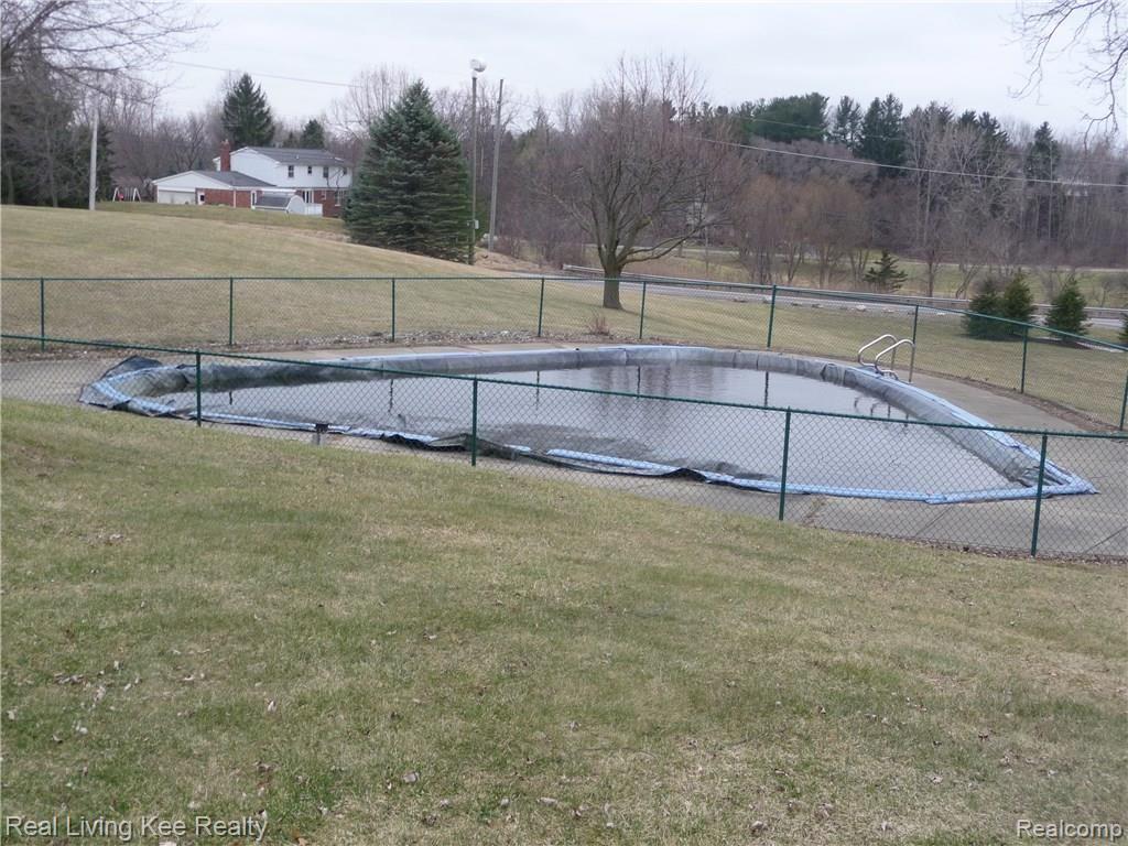 7207 28 Mile Road Washington, MI 48094 - Photo 26 of 35 Beautiful in-ground pool with access from walk-out basement will be open in April