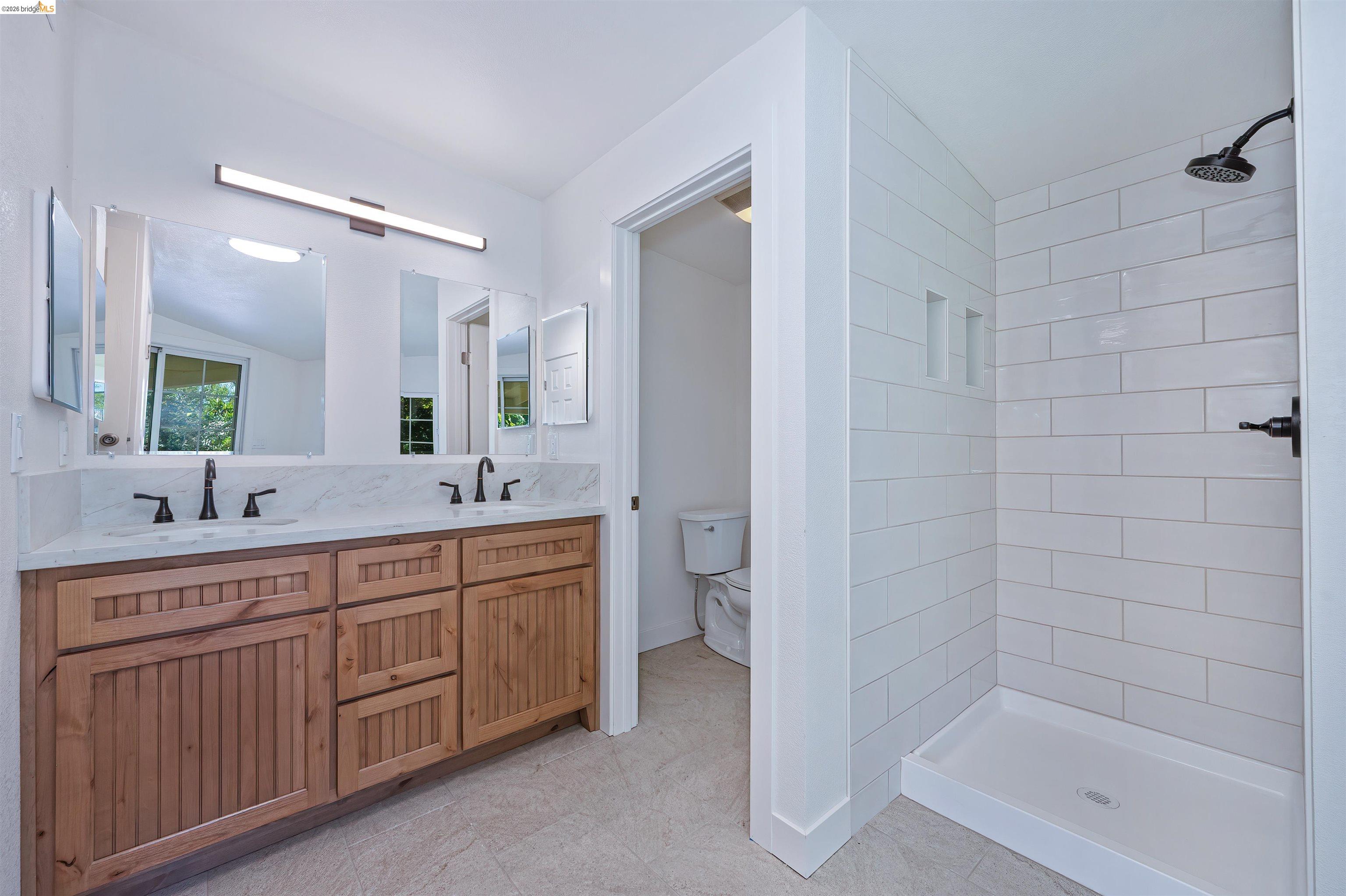 10474 Sheldon Road Elk Grove, CA 95624 - Photo 33 of 83 Double vanity with light wood-finish cabinetry and rectangular undermount sinks