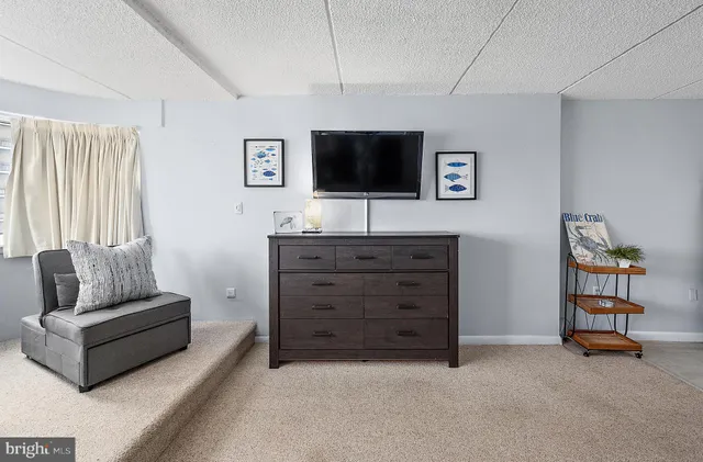 a kitchen with granite countertop white cabinets and appliances