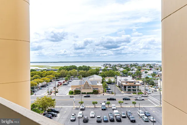 a view of a swimming pool with a patio and swimming pool
