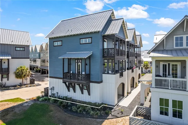 a front view of a residential apartment building with a yard
