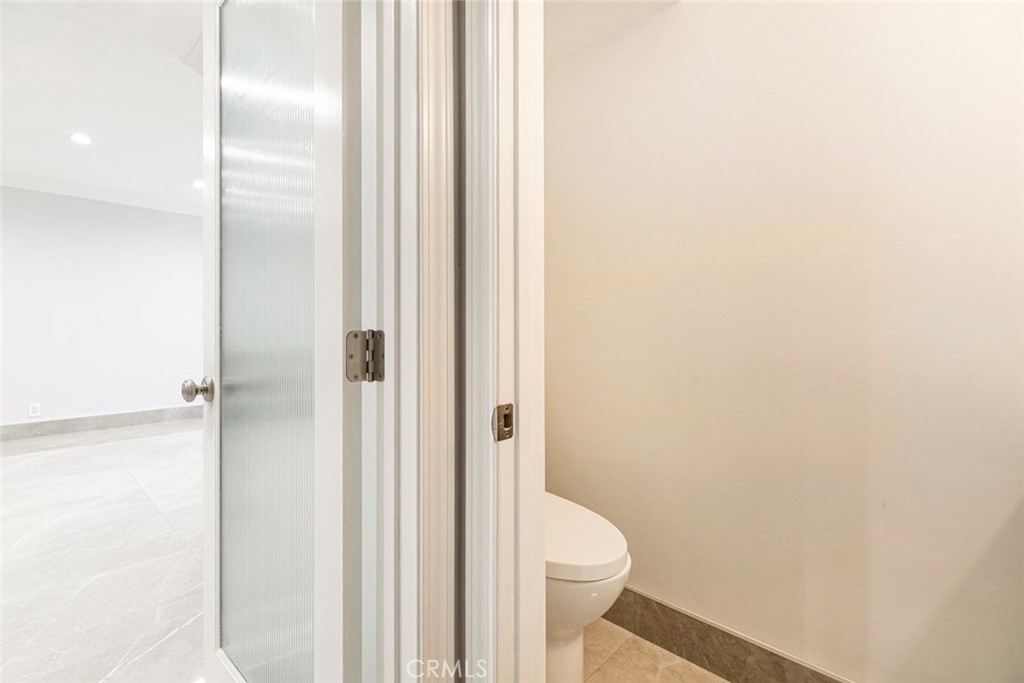 7901 Vía Stefano Burbank, CA 91504 - Photo 17 of 58 a white toilet sitting next to a bathroom sink