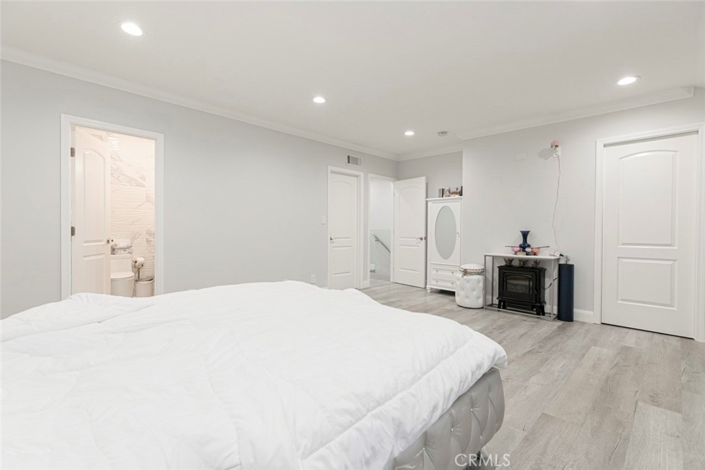 7901 Vía Stefano Burbank, CA 91504 - Photo 35 of 58 a bedroom with a bed and a view