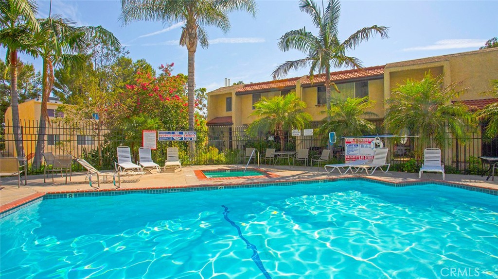 7901 Vía Stefano Burbank, CA 91504 - Photo 52 of 58 a view of a house with swimming pool and sitting area