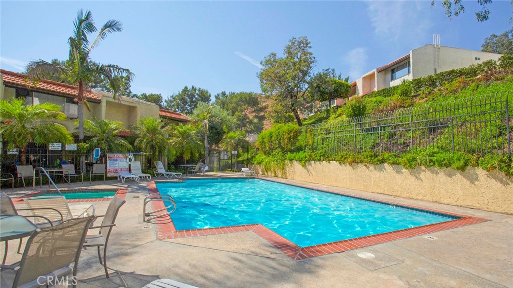 7901 Vía Stefano Burbank, CA 91504 - Photo 53 of 58 a view of swimming pool with outdoor seating and plants