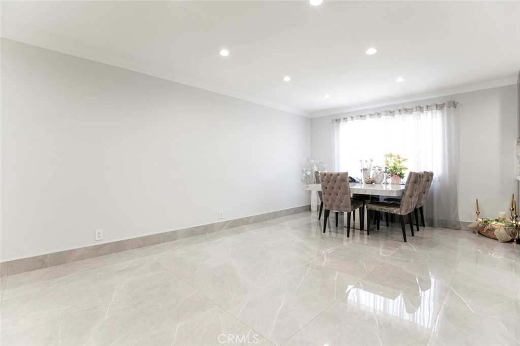 7901 Vía Stefano Burbank, CA 91504 - Photo 9 of 58 a dining room with furniture and a chandelier