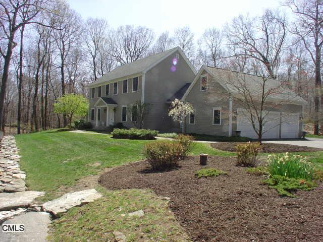 21 Tall Oaks Road Wilton, CT 06897 - Photo 1 of 1 a view of a house with a yard