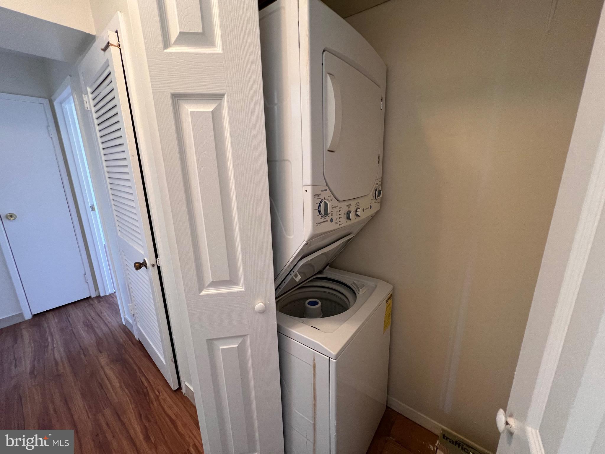 3964 Bel Pre Road, Unit 8 Silver Spring, MD 20906 - Photo 12 of 24 a view of a storage and utility room with washer and dryer