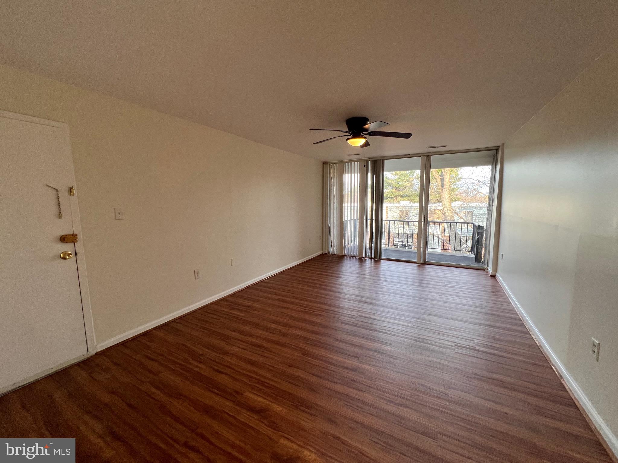 3964 Bel Pre Road, Unit 8 Silver Spring, MD 20906 - Photo 19 of 24 wooden floor in an empty room with a window