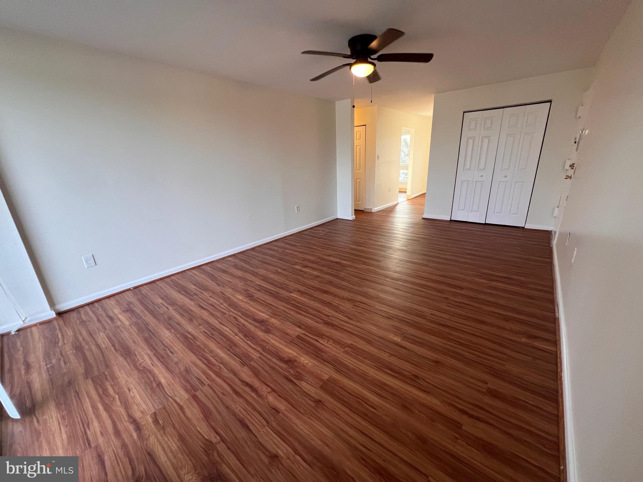 3964 Bel Pre Road, Unit 8 Silver Spring, MD 20906 - Photo 20 of 24 wooden floor in an empty room with a window