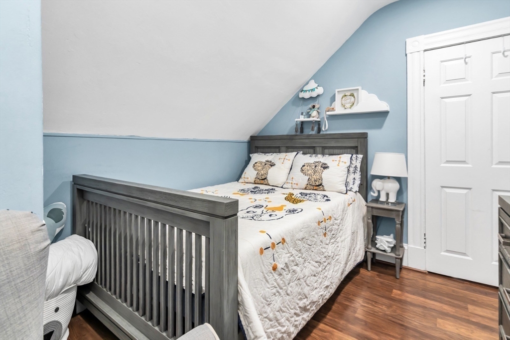 42 D Street Lowell, MA 01851 - Photo 27 of 27 a bed sitting in a bedroom next to a window